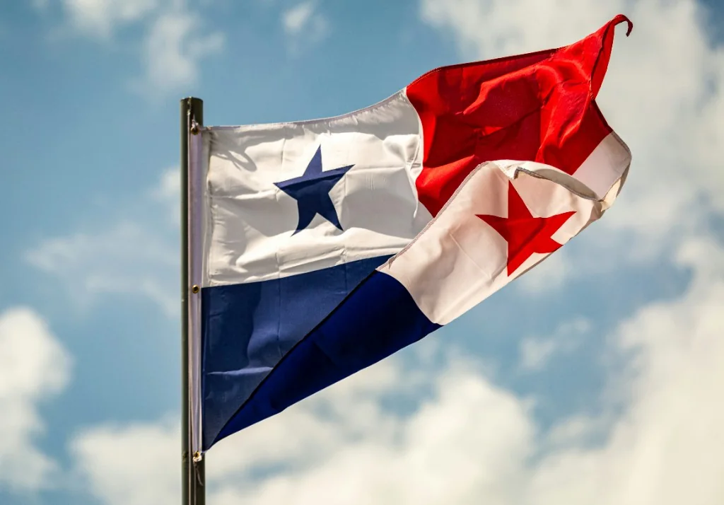 Panamanian flag waving against a blue sky