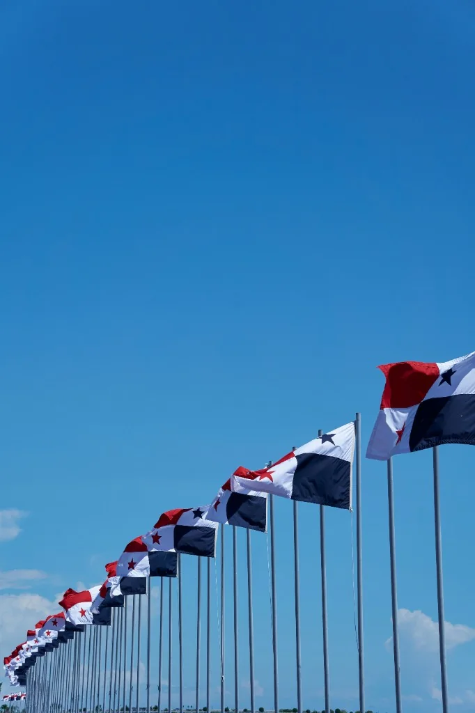 A row of Panamanian flags against a clear sky